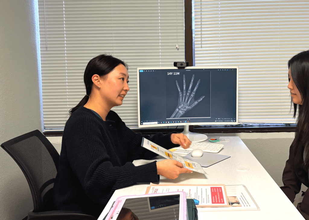 Sunjo Chung FNP providing expert pediatric growth consultation at I Grow Clinic.