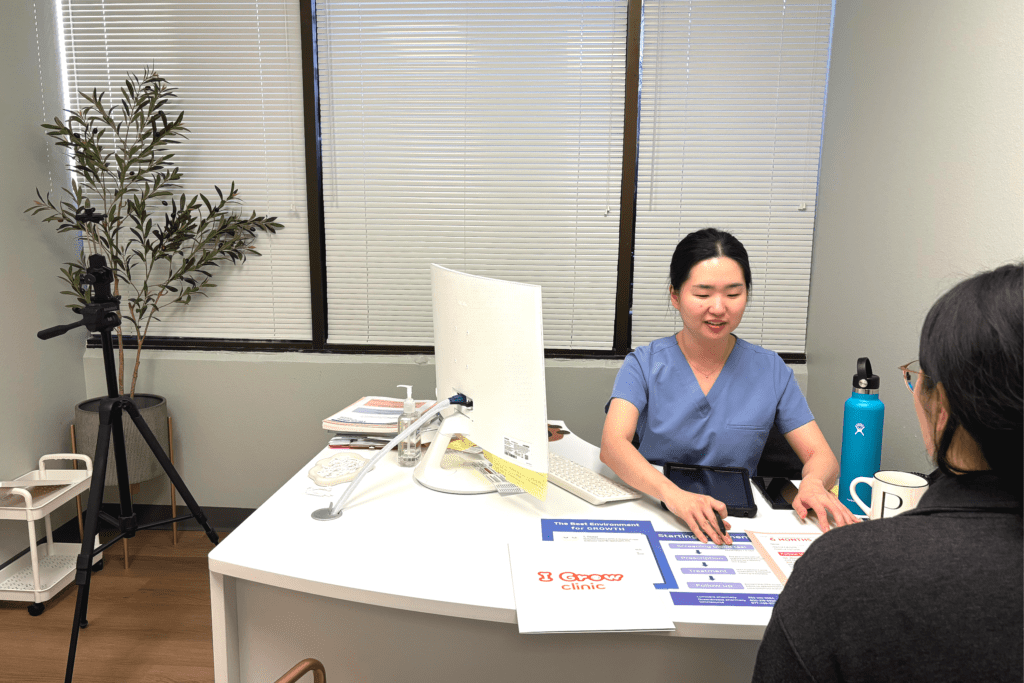 Manager at I Grow Clinic, explaining to a family why pharmaceutical-grade recombinant human growth hormone is the evidence-based standard of care compared to unregulated peptide alternatives.