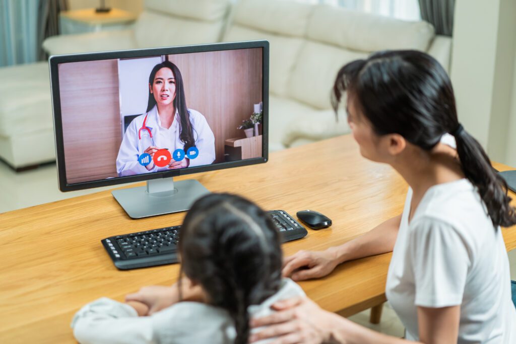 Mother and child having a pediatric growth hormone telehealth consultation from home with I Grow Clinic specialist in California