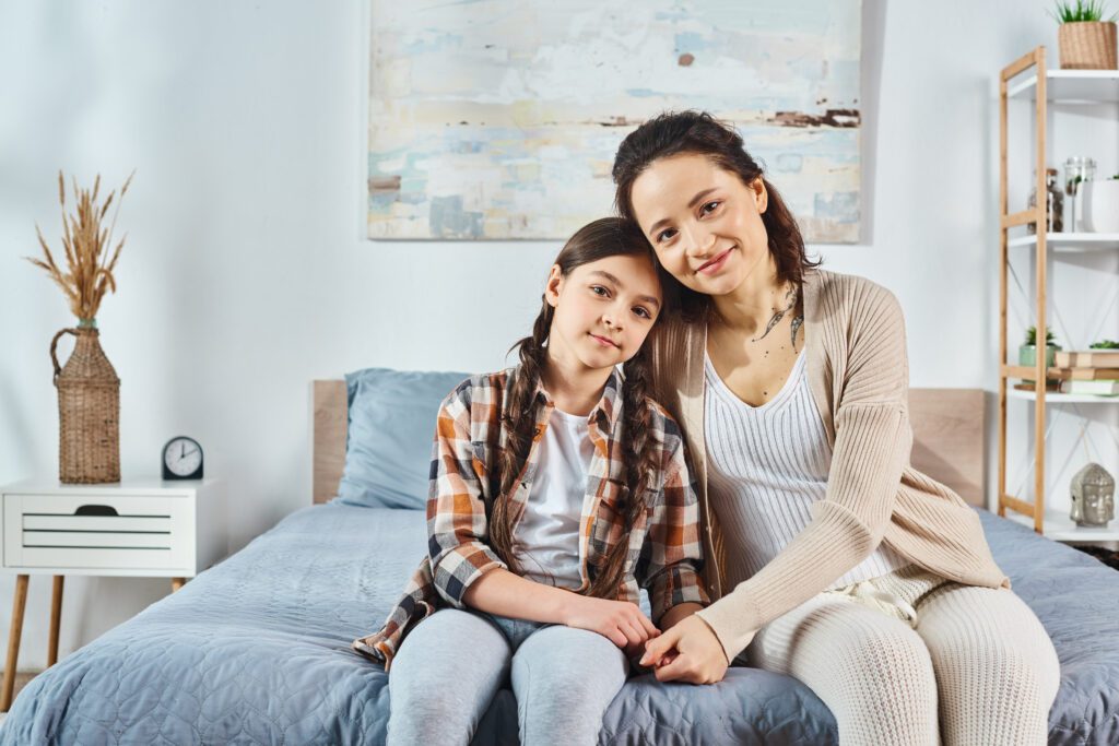 A mother and daughter standing together, reflecting on growth and development, with I Grow Clinic specializing in pediatric growth evaluation and bone age analysis.