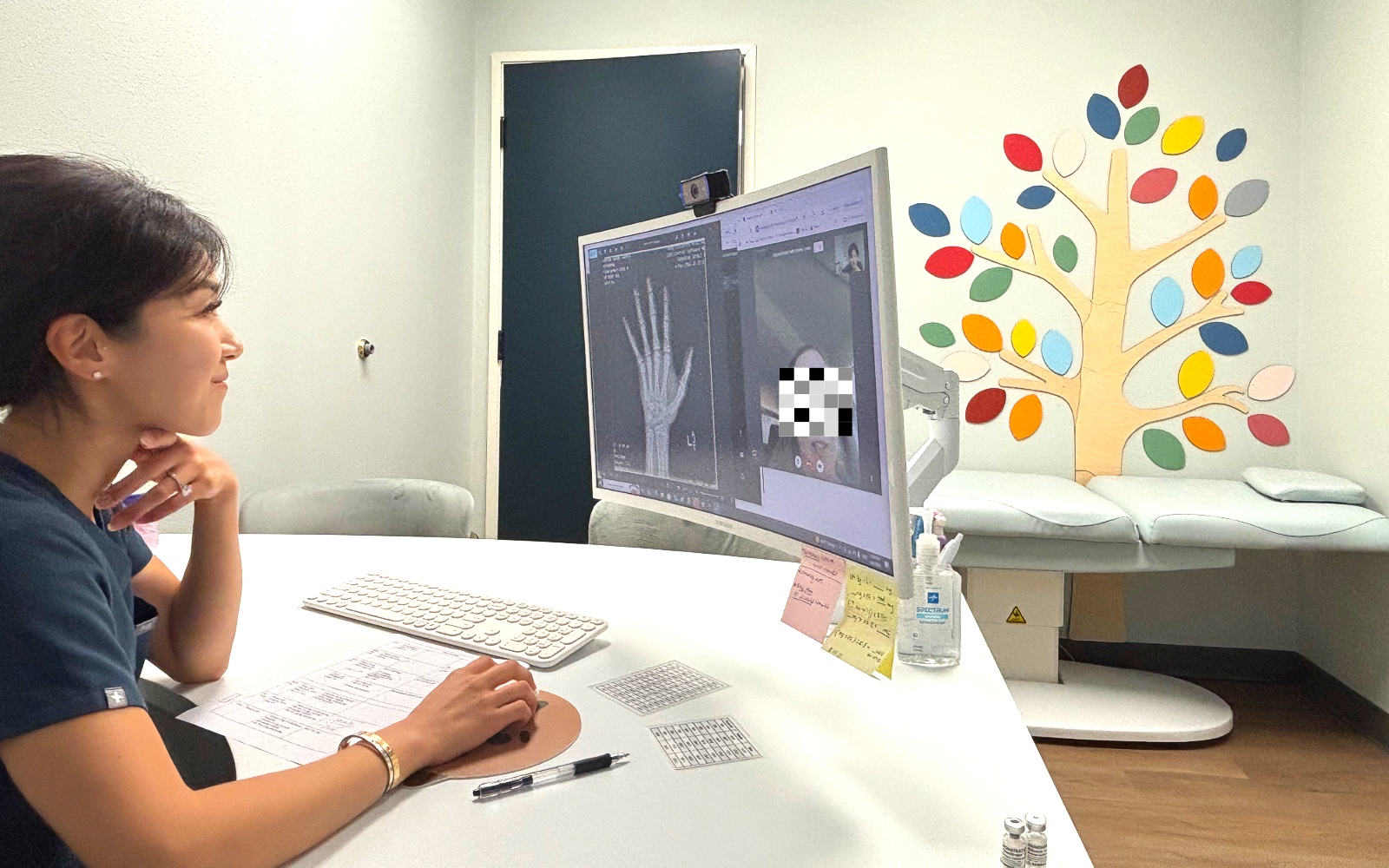 Yuri Kim FNP-C at I Grow Clinic conducting a telehealth consultation with bone age X-ray on screen
