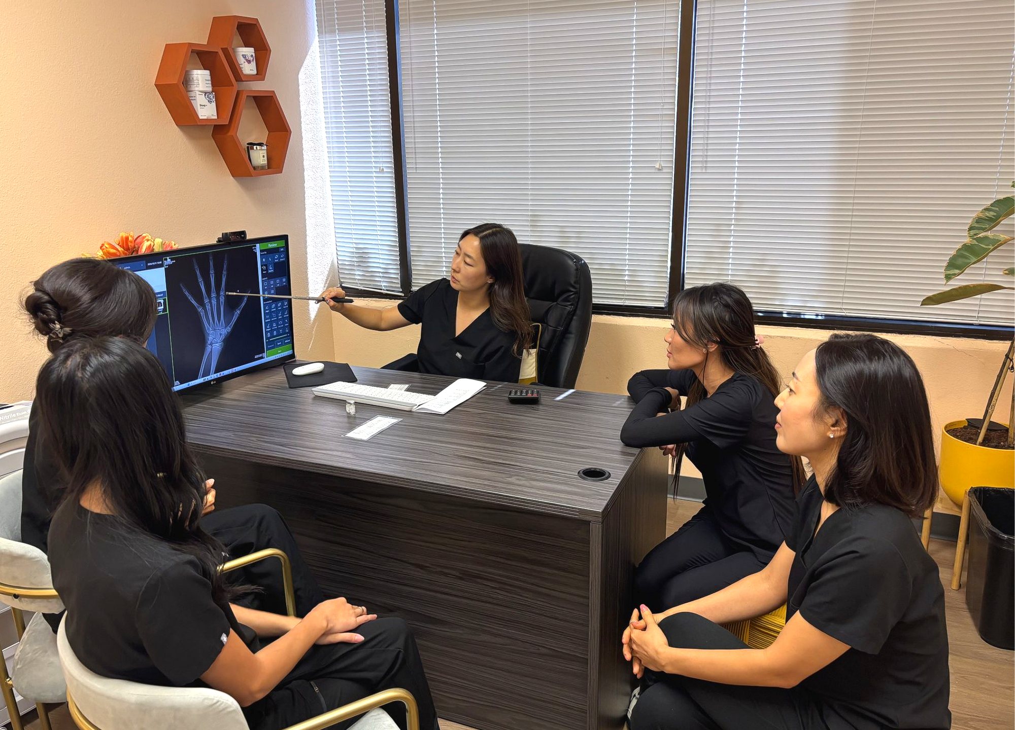 I Grow Clinic provider team reviews a hand X-ray to evaluate growth hormone deficiency symptoms in children