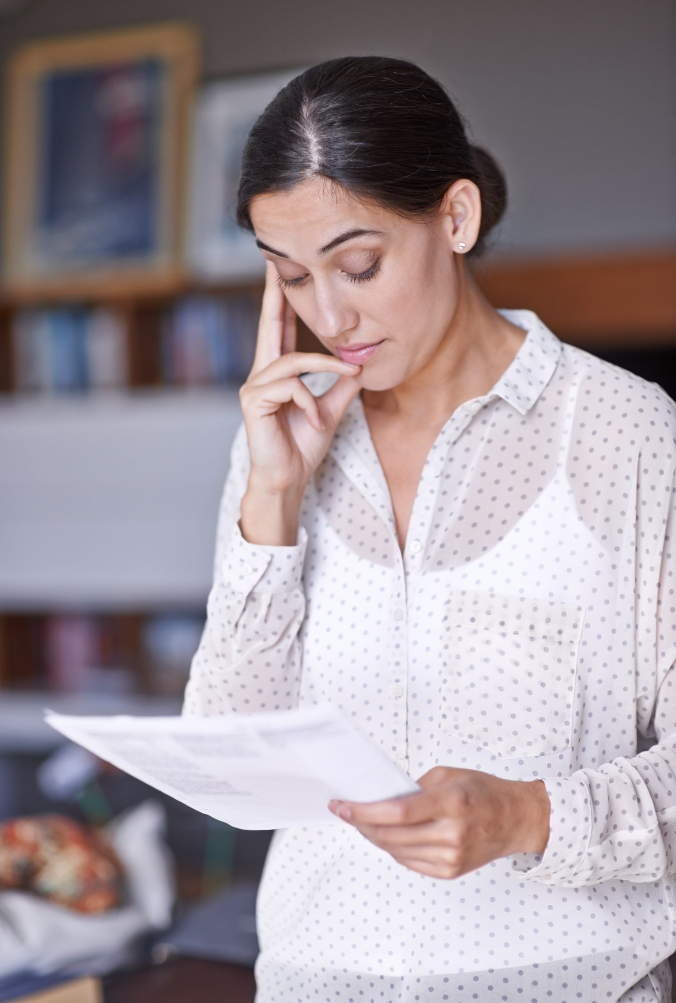 Mother reading her child's borderline growth hormone test result at home